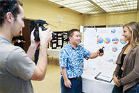 A student explains his project at the Kauai Science Fair.